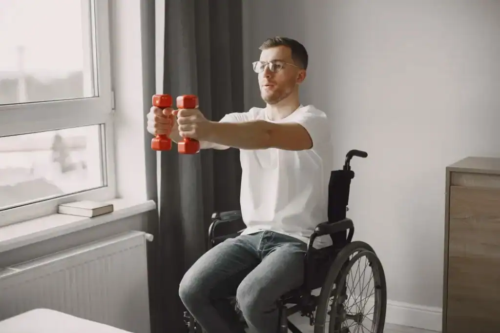 Image of man doing exercise in his wheelchair to aid weight loss Bedfordshire