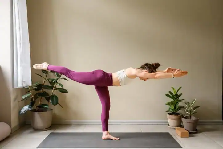 Achieving the Perfect Tone: How Often Should You Exercise for Results? 1 Woman doing Yoga exercise Bedfordshire to help with toning the body.
