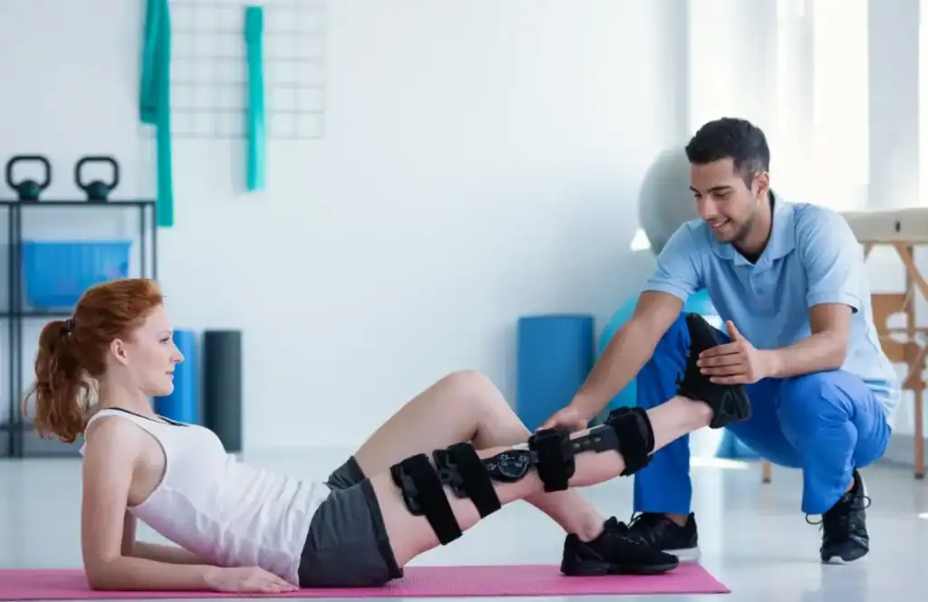 Woman having treatment to help muscle recovery Bedfordshire after an injury