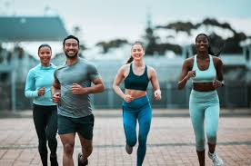 Sculpting Sleek Arms: The Essential Role of Cardio in Toning Without Bulking Up 3 image of people running to incorporate cardio Bedfordshire exercise into their life to help tone arms and body.