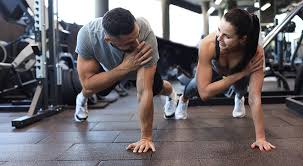 Image of man and woman doing Cardio Bedfordshire to tone their arms. 